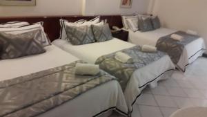 Postel nebo postele na pokoji v ubytování Hotel Arenal