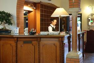 a man sitting at a bar in a restaurant at Hotel Valdor in Cavallino-Treporti +37 photos