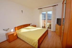 Postel nebo postele na pokoji v ubytování Apartment Anton