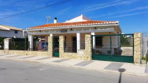 a building on the side of a street at Anacasa Villa Faig Playa Burguera Terranova CH2500 in Oliva