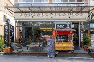 a store front with a table in front of it at Yuan Su B&B in Yuchi
