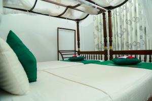 Postel nebo postele na pokoji v ubytování Goyambokka Guesthouse