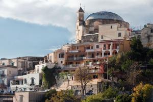 a building with a mosque on top of a hill at Casa Le Terrazze in Positano