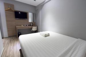Postel nebo postele na pokoji v ubytování Hotel 99 SS2 Petaling Jaya