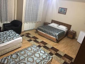A bed or beds in a room at Hotel Kervansaray