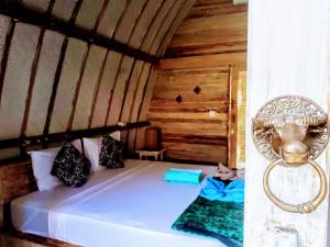 Postel nebo postele na pokoji v ubytování Gili Matiki