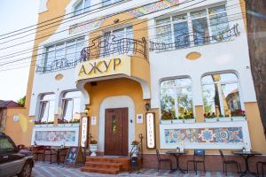 a building with a sign that reads ayrop on it at Hotel Ajur in Odesa