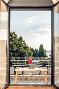 a view from the window of a patio with a table at Urban Loft & Urban Flat 2024 in Kavala