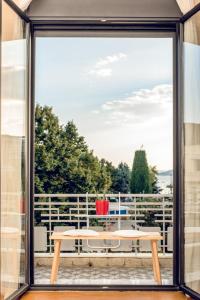 a view from the window of a patio with a table at Urban Loft & Urban Flat 2024 in Kavála