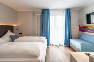 Postel nebo postele na pokoji v ubytování Westend Hotel (non-smoking)