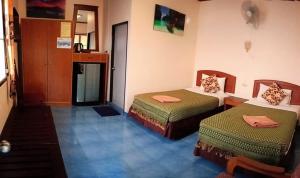 Postel nebo postele na pokoji v ubytování Anawin Bungalows