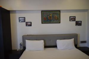 Voodi või voodid majutusasutuse Athi Resorts toas