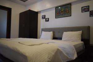 Voodi või voodid majutusasutuse Athi Resorts toas
