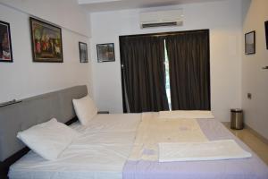 Voodi või voodid majutusasutuse Athi Resorts toas