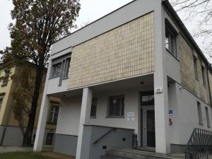 a building with a tan and white facade at WILla Medica in Poznań