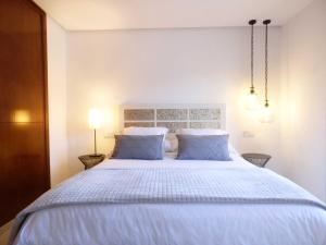 Postel nebo postele na pokoji v ubytování Polo Apartments - Benahavís