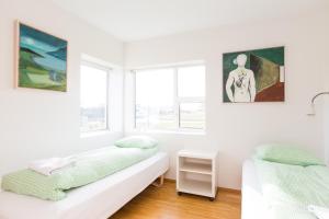 Postel nebo postele na pokoji v ubytování Kvöldstjarnan Gistiheimili + 37 fotografií