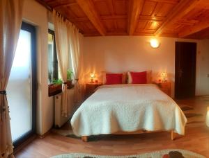 Ένα ή περισσότερα κρεβάτια σε δωμάτιο στο Pension Casa Aurora +52 φωτογραφίες