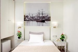 Postel nebo postele na pokoji v ubytování Hotel Ideon