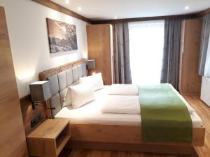 Ένα ή περισσότερα κρεβάτια σε δωμάτιο στο Denggnhof
