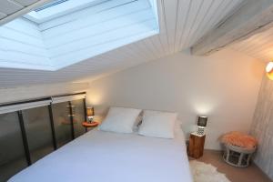 Postel nebo postele na pokoji v ubytování 6 Rue d'Aubuisson