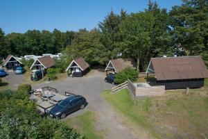 an aerial view of a camp with a car parked in a parking lot at Svalereden Strand Camping Cottages in Frederikshavn