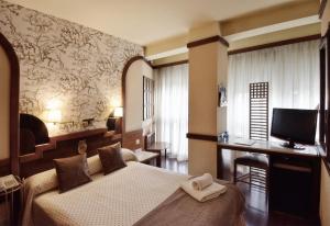 TV a/nebo společenská místnost v ubytování Hotel Maria Luisa