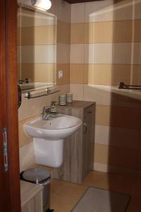 a bathroom with a sink and a toilet and a tub at Apartmán Hrabovo 203 Fatrapak 2 in Ružomberok