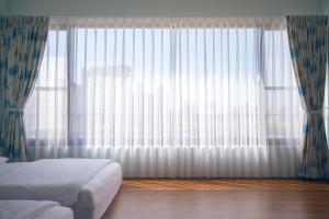 Letto o letti in una camera di 5+1 Homestay
