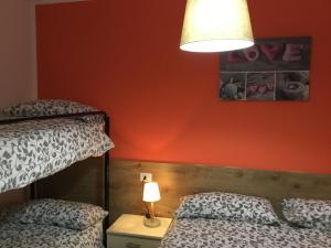 A bed or beds in a room at Home Iseo Lake