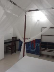 Arcade Beach Hotel客房内的一张或多张床位