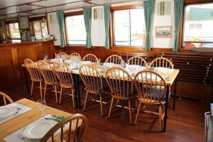 a dining room with a long table and chairs at MPS Flora in Amsterdam +20 photos