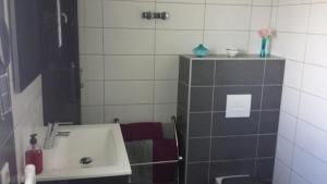 a bathroom with a sink and a mirror at Le petit Ventoux in Malaucène +13 photos