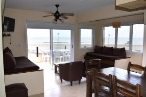 a living room with a view of the ocean at Namaste casas de mar in Villa Gesell