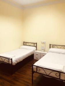 A bed or beds in a room at El cordal de laciana