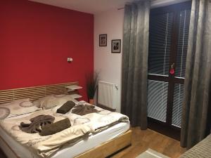 A bed or beds in a room at Apartment Primulka