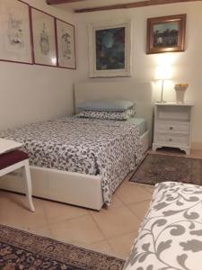 A bed or beds in a room at Locanda Bellavista