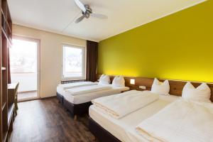 Postel nebo postele na pokoji v ubytování Basic Hotel Innsbruck
