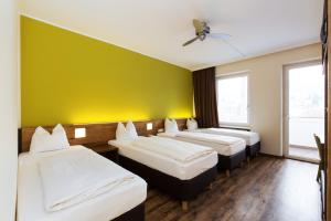 Postel nebo postele na pokoji v ubytování Basic Hotel Innsbruck