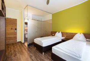 Postel nebo postele na pokoji v ubytování Basic Hotel Innsbruck