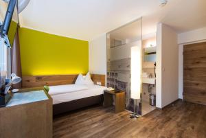 Postel nebo postele na pokoji v ubytování Basic Hotel Innsbruck