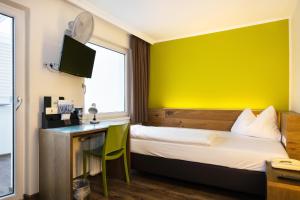 Postel nebo postele na pokoji v ubytování Basic Hotel Innsbruck