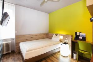 Postel nebo postele na pokoji v ubytování Basic Hotel Innsbruck