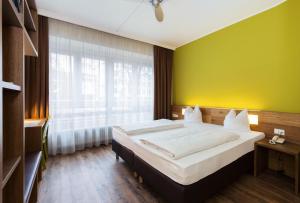 Postel nebo postele na pokoji v ubytování Basic Hotel Innsbruck