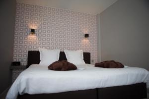 Postel nebo postele na pokoji v ubytování B&B Maison Kerkhove