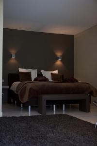 Postel nebo postele na pokoji v ubytování B&B Maison Kerkhove