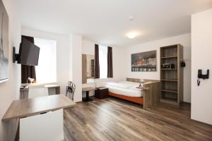 Posteľ alebo postele v izbe v ubytovaní Apartments Leipziger Hof + 22 fotografií
