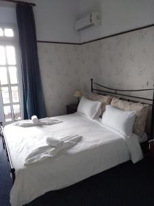 Postel nebo postele na pokoji v ubytování Elafos Hotel