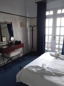 Postel nebo postele na pokoji v ubytování Elafos Hotel