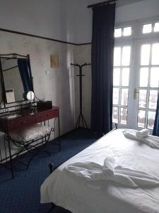 
מיטה או מיטות בחדר ב-Elafos Hotel
